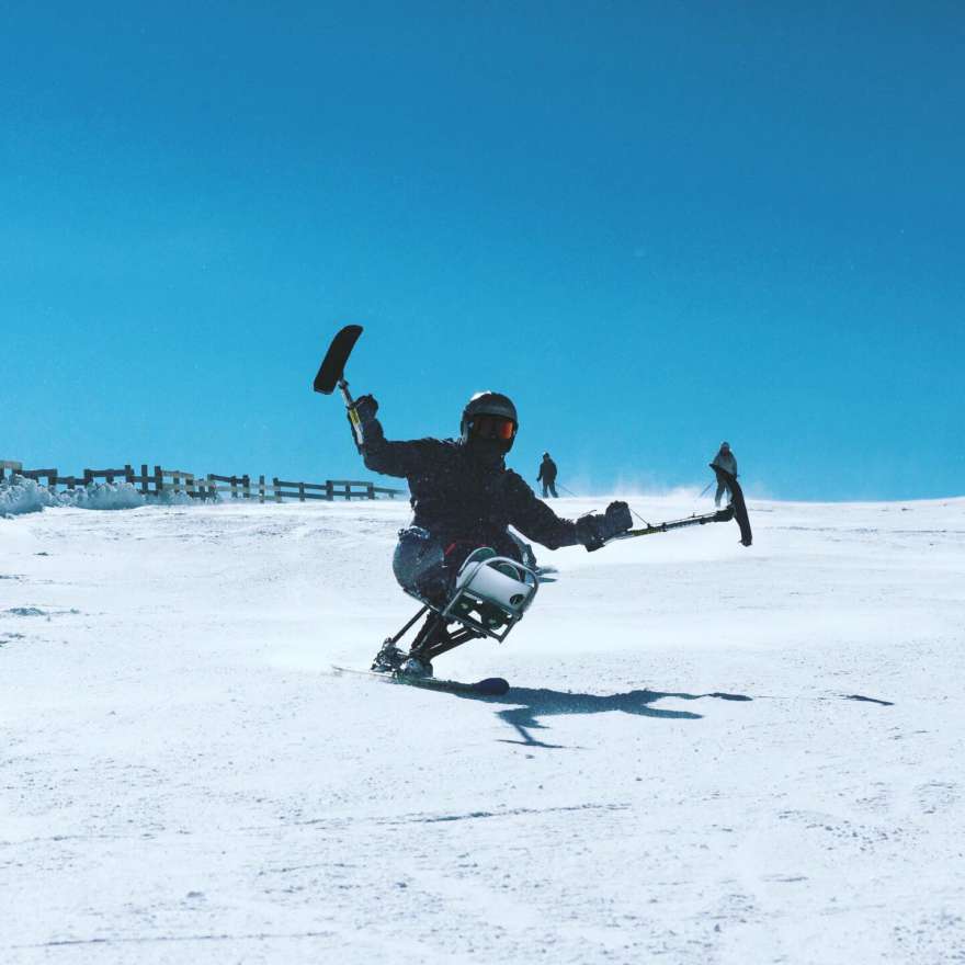 Wheelchair skier poses for photo