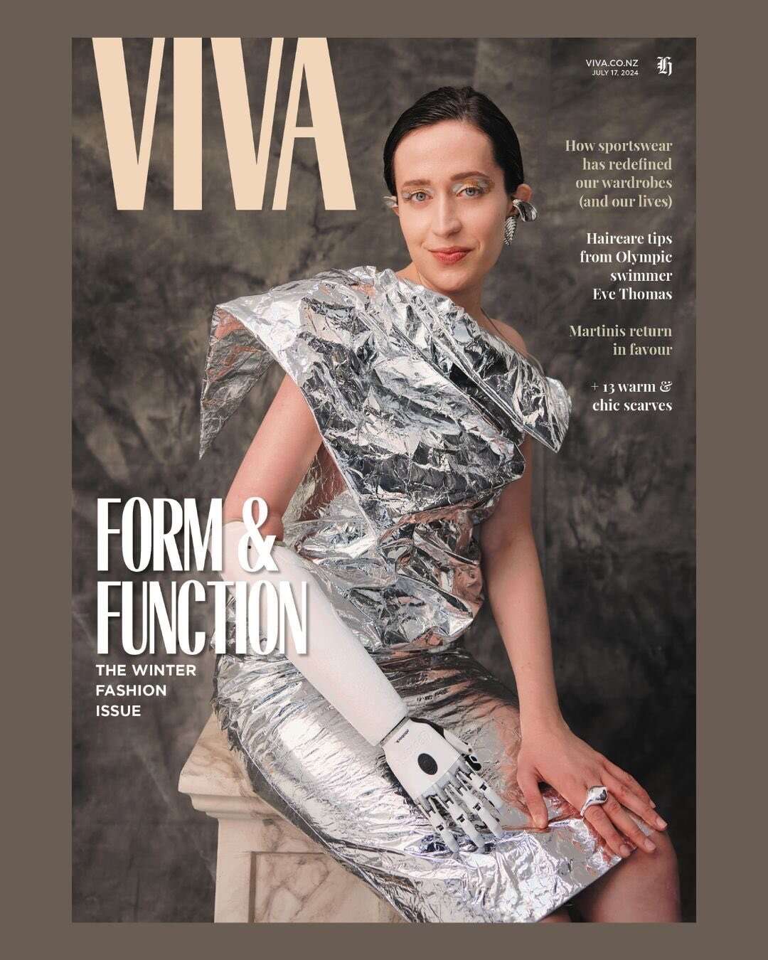 Magazine cover, wearing a silver dress.