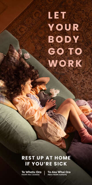 Mamie on a couch recovering from flu. Tissues strawn. It reads, "Let Your Body go to work"